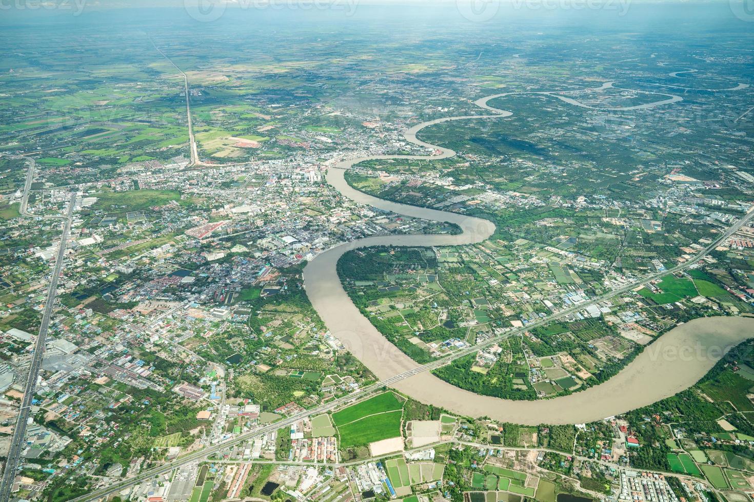 Beautiful Curve River was shot on the plane in the noon. It can see farming and valley all around. photo