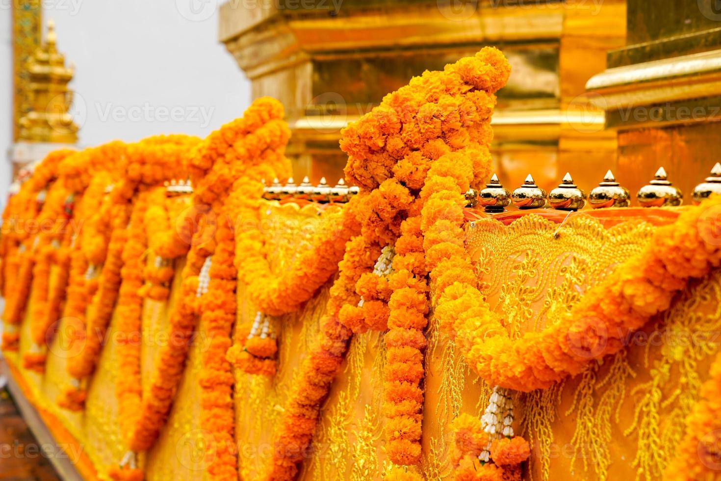 Thai garland on pagoda barricade photo