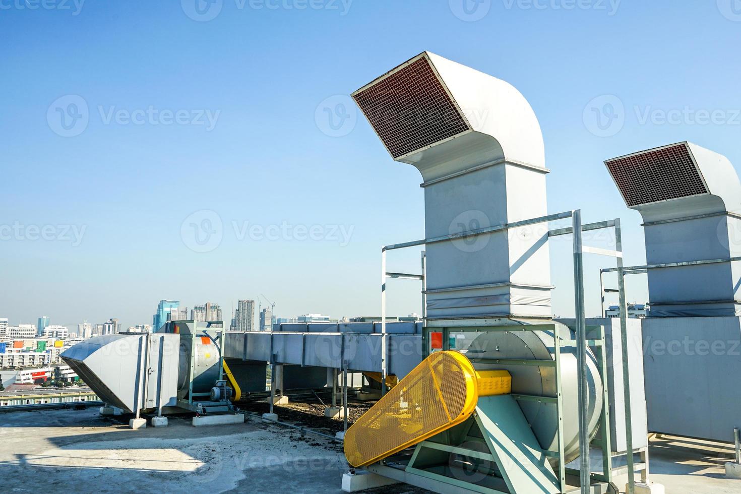 The industrial machine at the rooftop of the huge building. photo