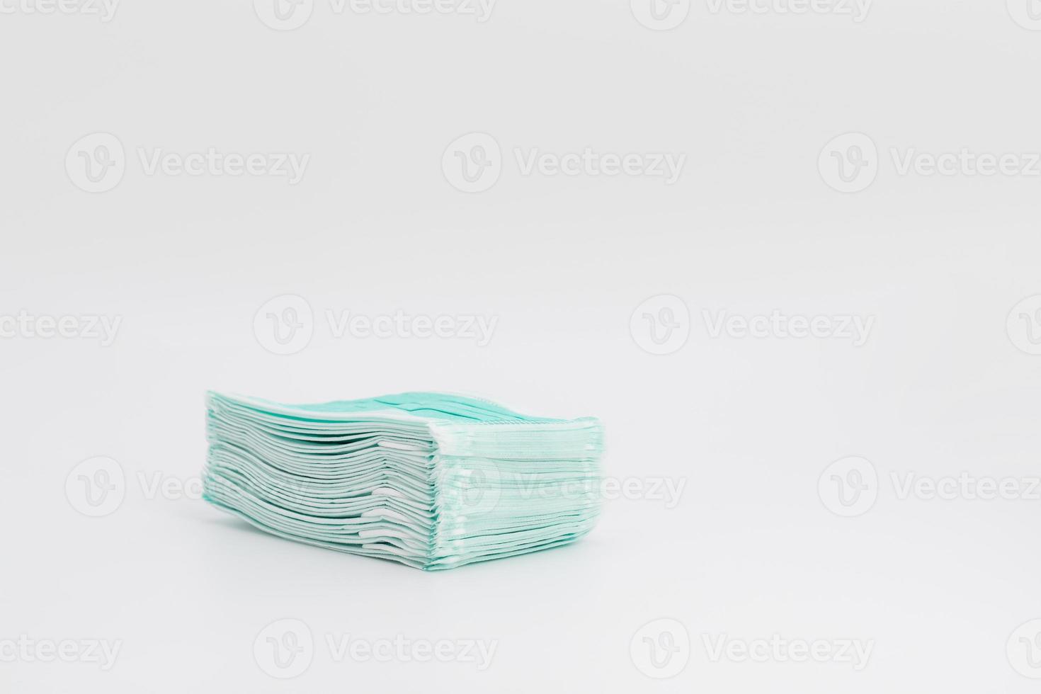 Isolated New green Hygienic Mask on the white background in studio light. photo