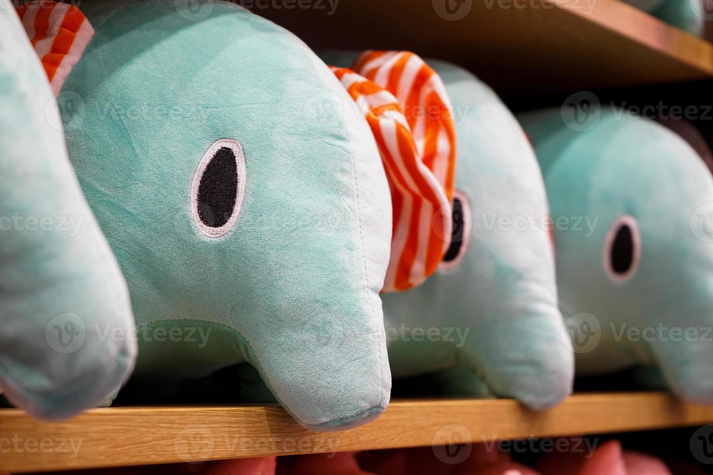 Elephant dolls for sales lay down on the sheft. photo