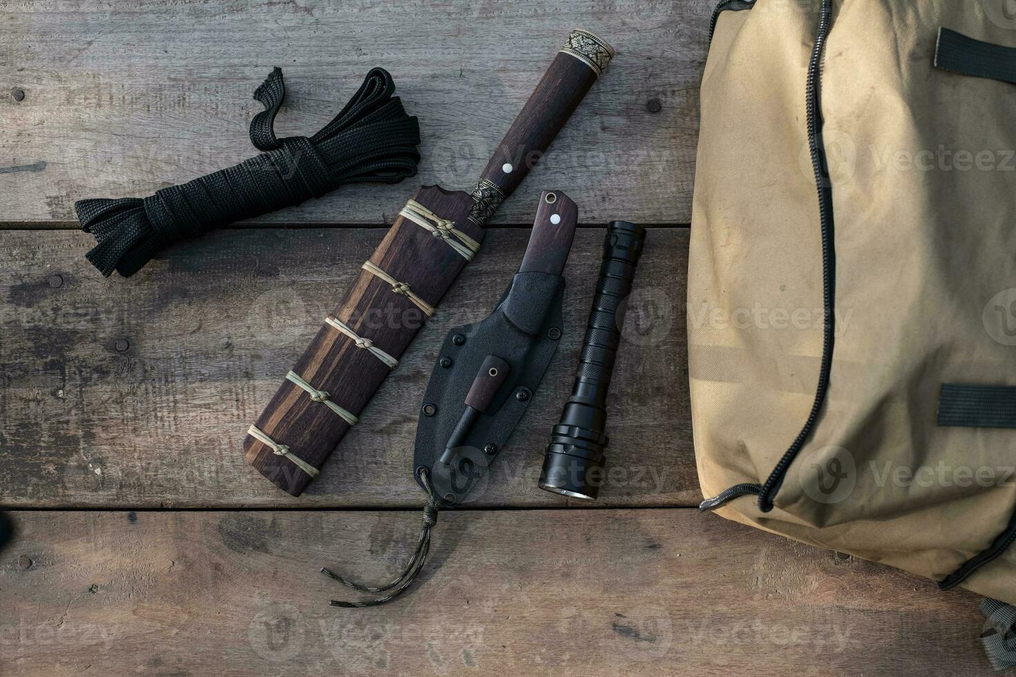A knife with equipment for survival in the forest photo