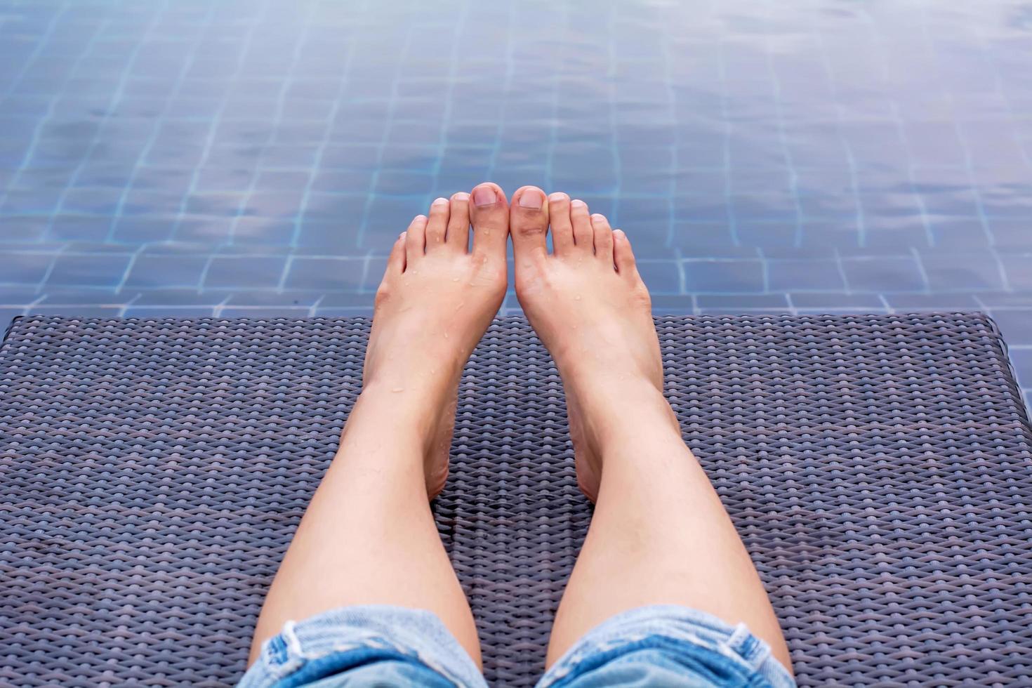 A girl showing legs on a canvas bed. photo