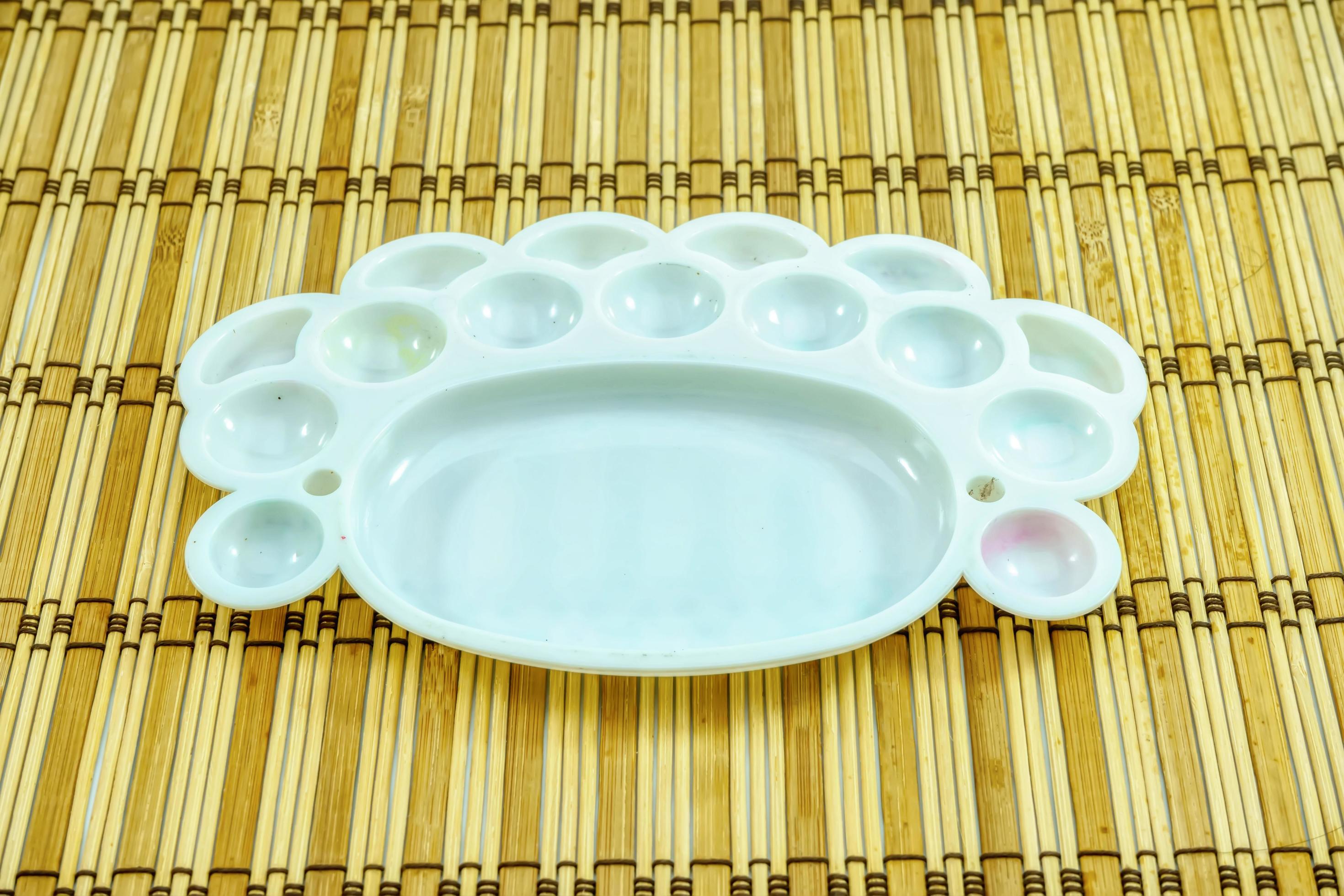 Watercolor tray on a wooden background. 7988372 Stock Photo at Vecteezy