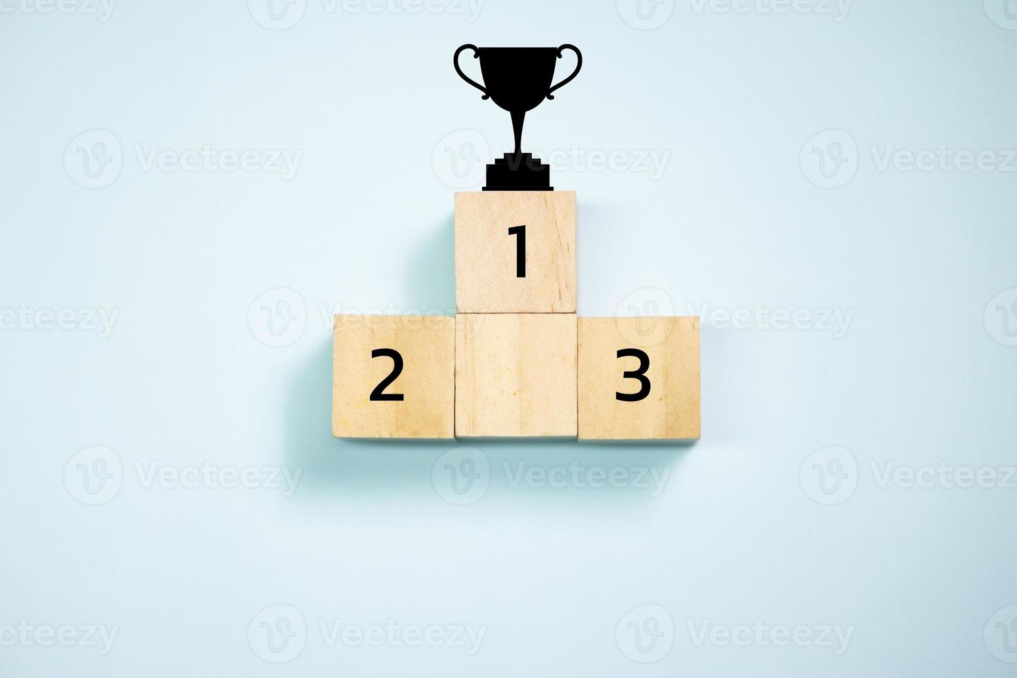 Top view trophy on top of wooden blocks  set  to podium. Concept for success and teamwork. photo