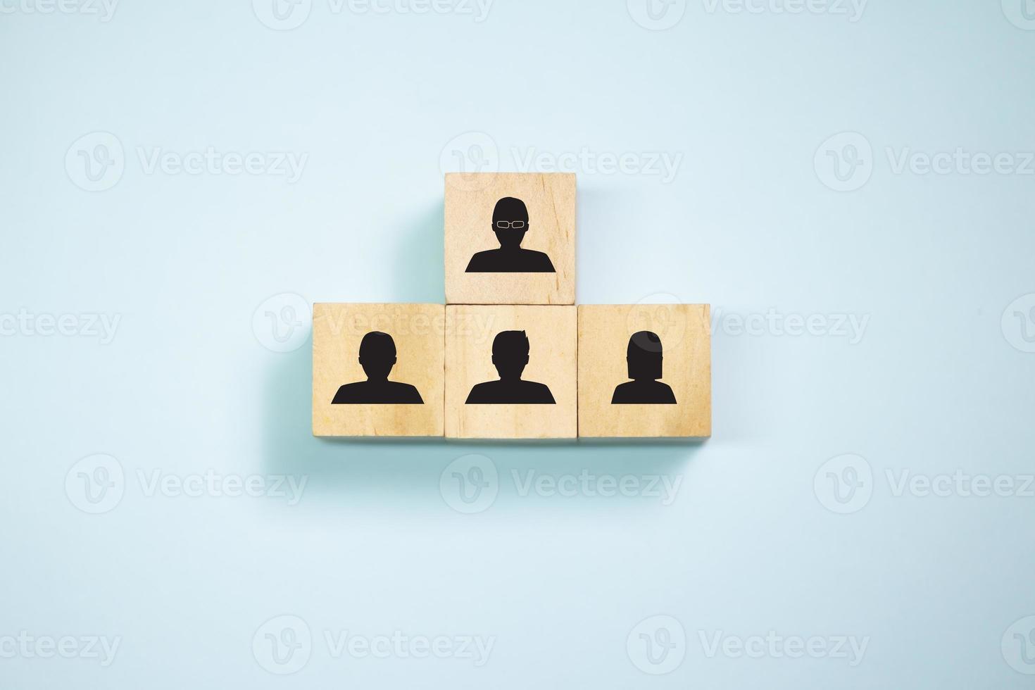 Top view wooden blocks with people icon set  to podium. Concept for company and human resorce manangement. photo