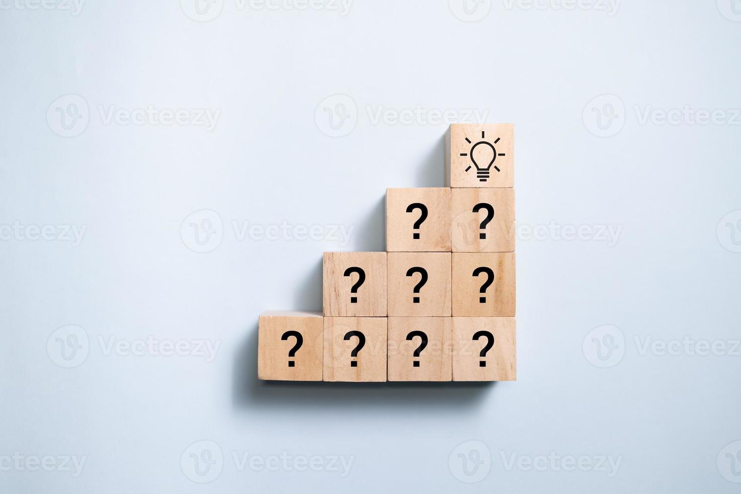 Top view wooden blocks set to step from question to idea. Concept for creative and design solution. photo