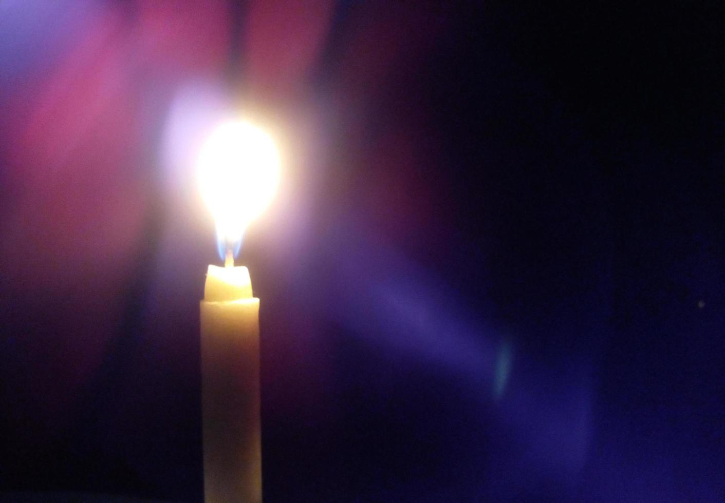 Candlelight illuminates the darkness photo