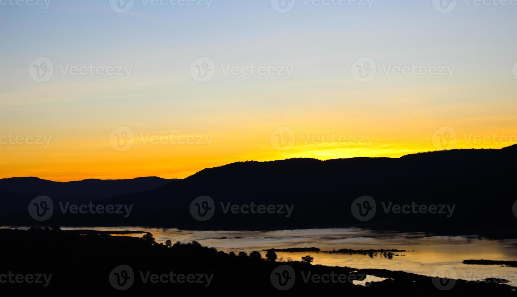 Before sunrise behind mountain photo