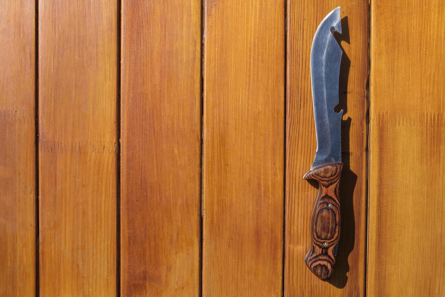 Knife for cooking on a wooden table photo