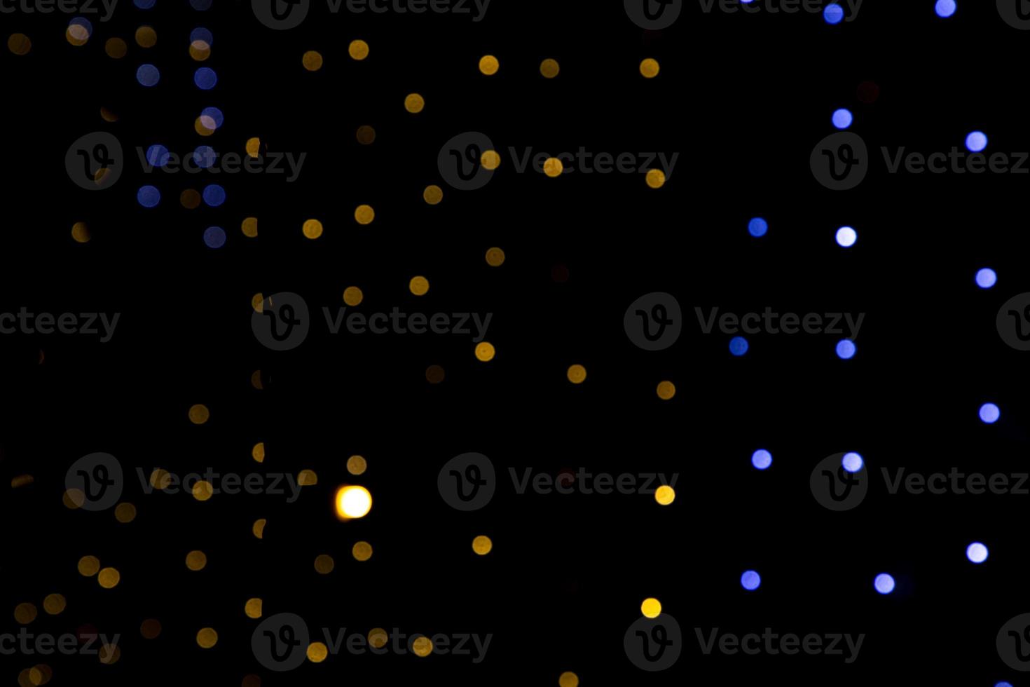 Black background with golden light effects. background with  Blur bokeh effects. Abstract background texture photo