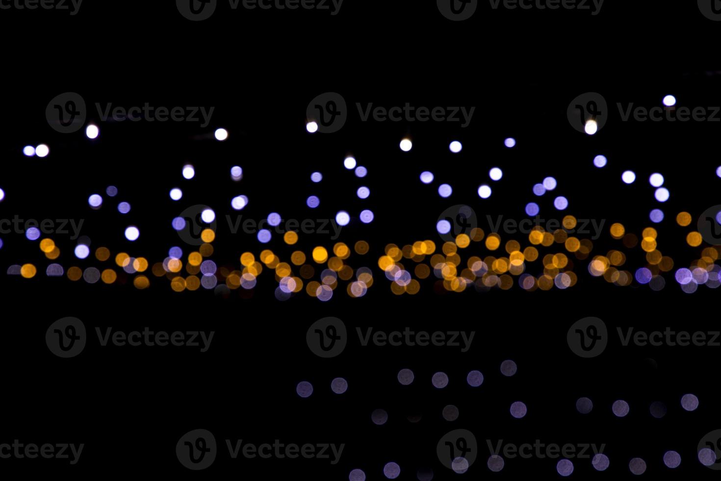 Black background with golden light effects. background with  Blur bokeh effects. Abstract background texture photo