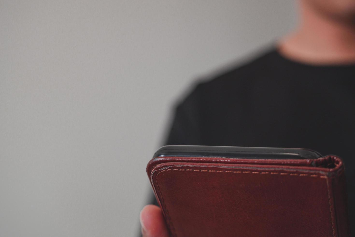 The man use a smartphone for work, social media and relaxation. Medium close up shot. photo