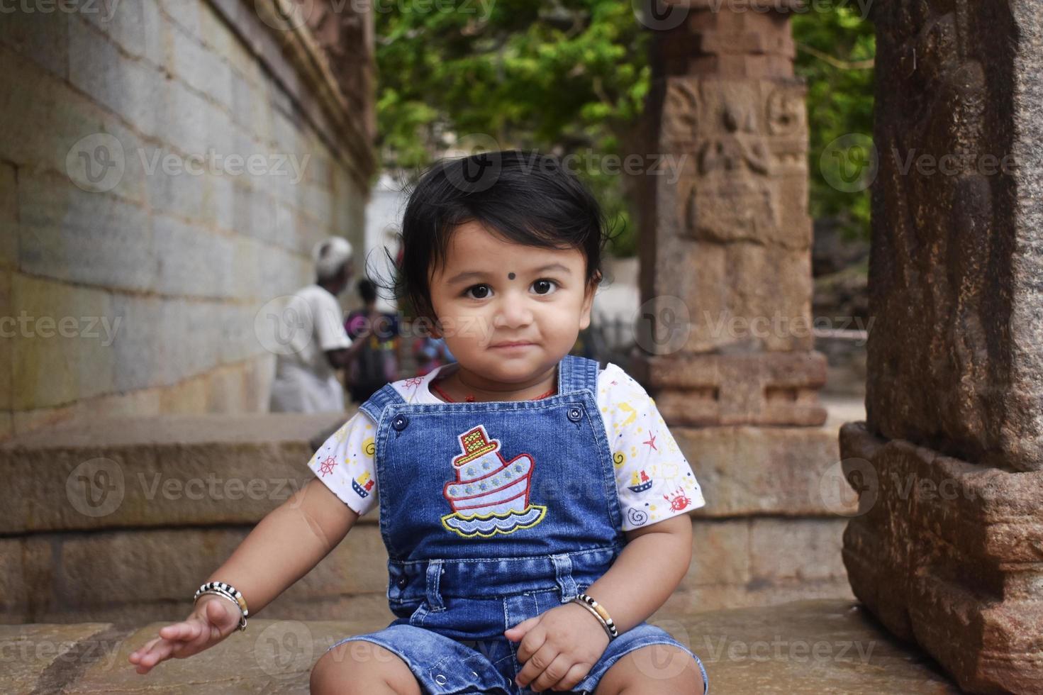A cute little baby girl in joy mood photo
