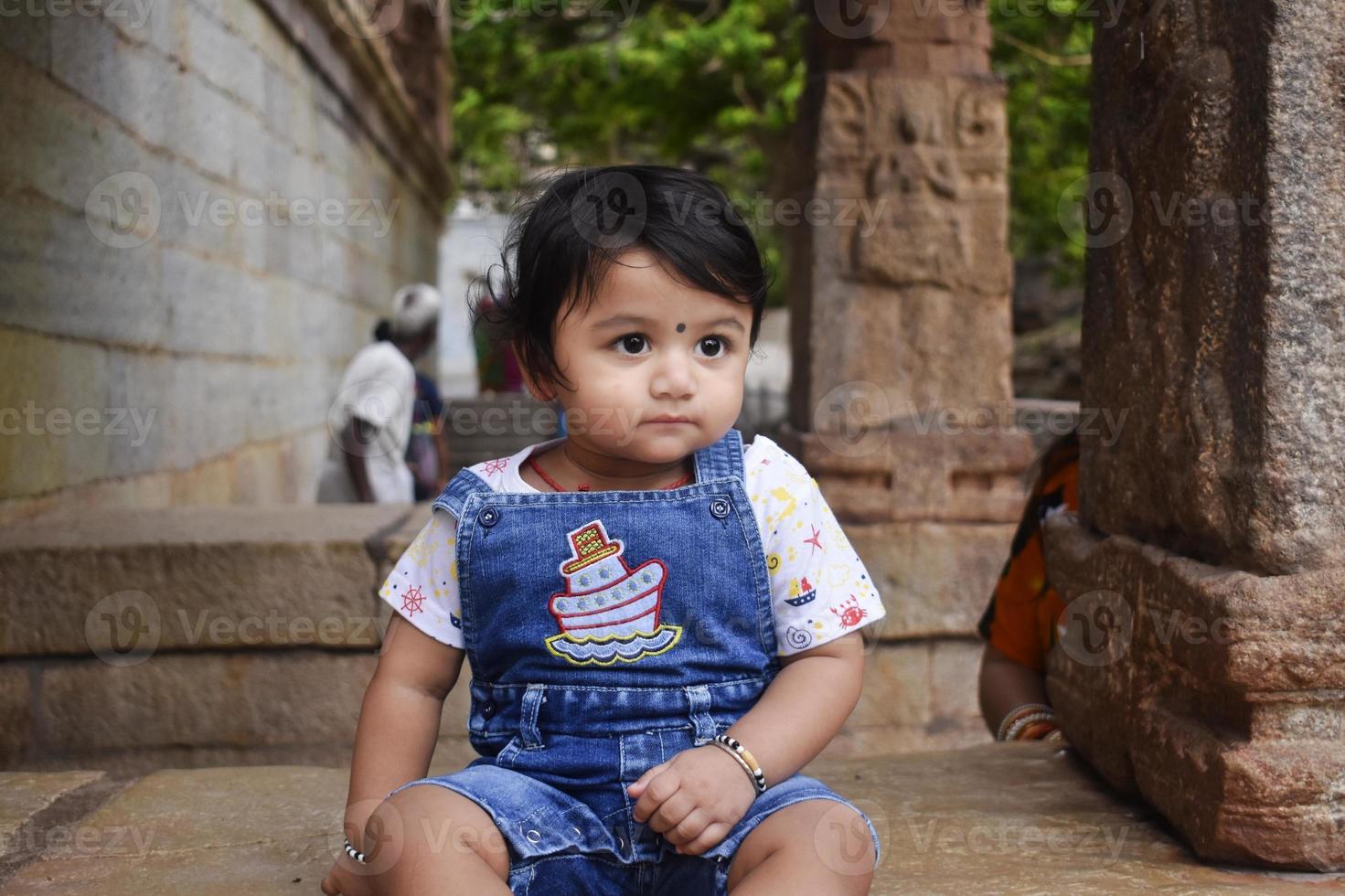 A cute little baby girl in joy mood photo