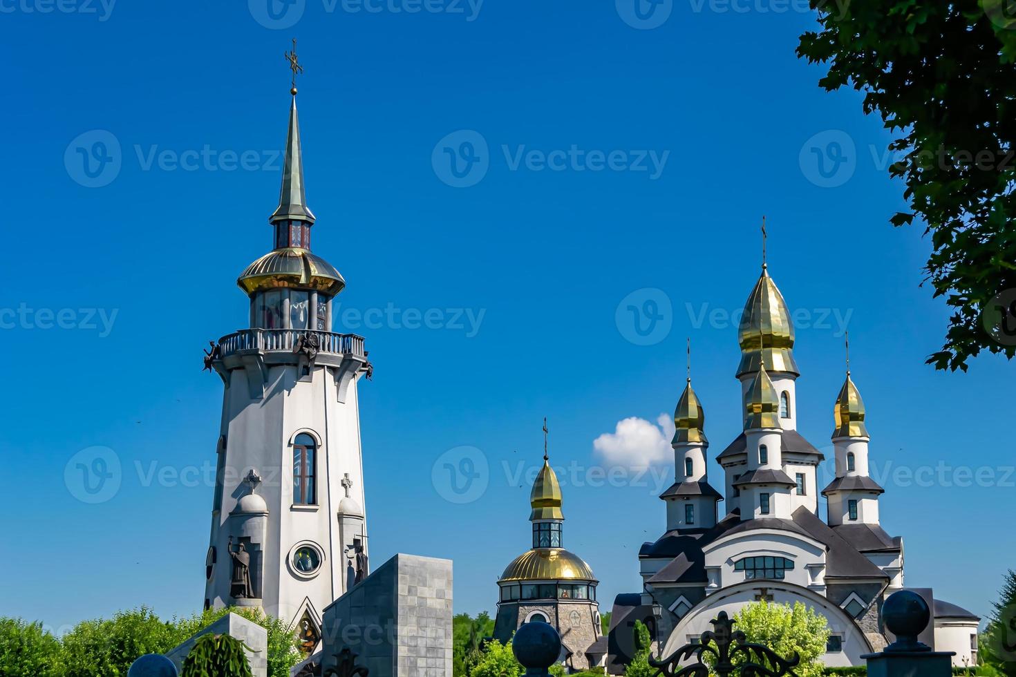 Christian church cross in high steeple tower for prayer photo