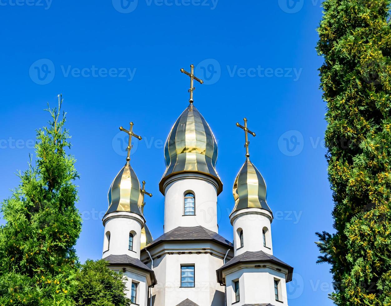 Christian church cross in high steeple tower for prayer photo