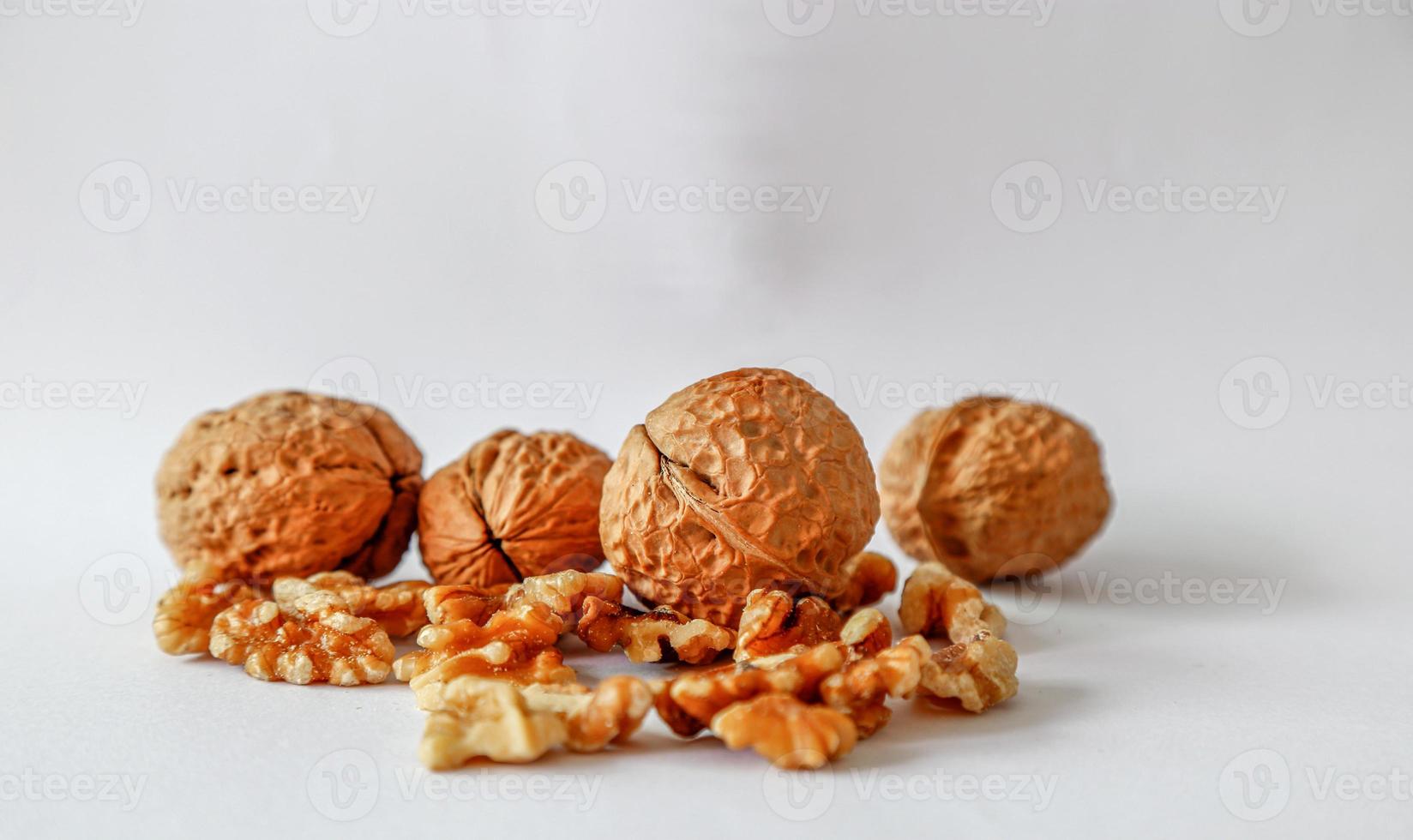 Group of walnuts and seed on white background. photo