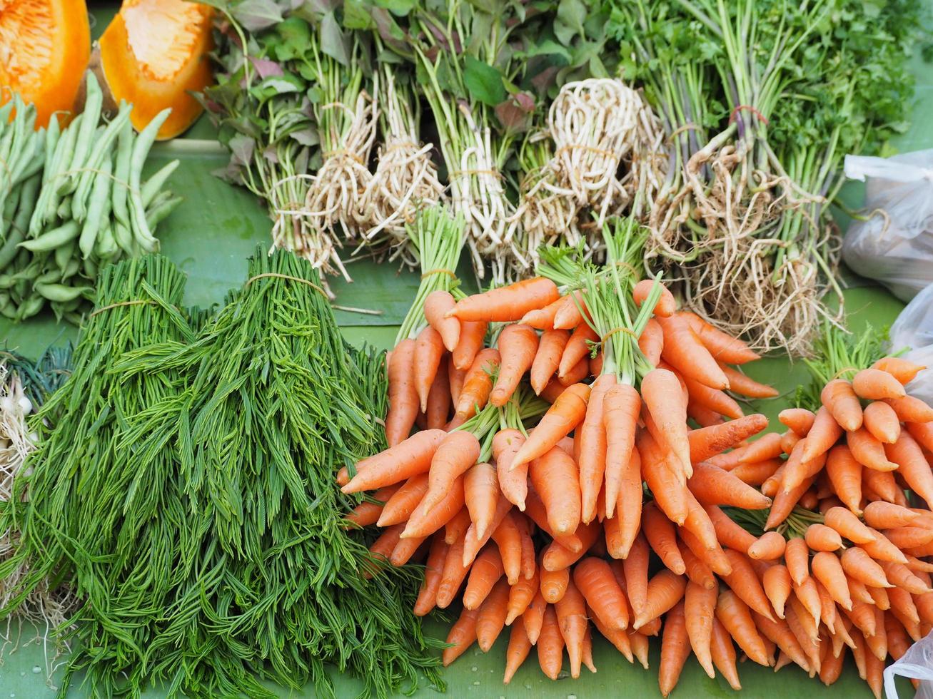 Close-up of fresh organic carrots for sale in market photo