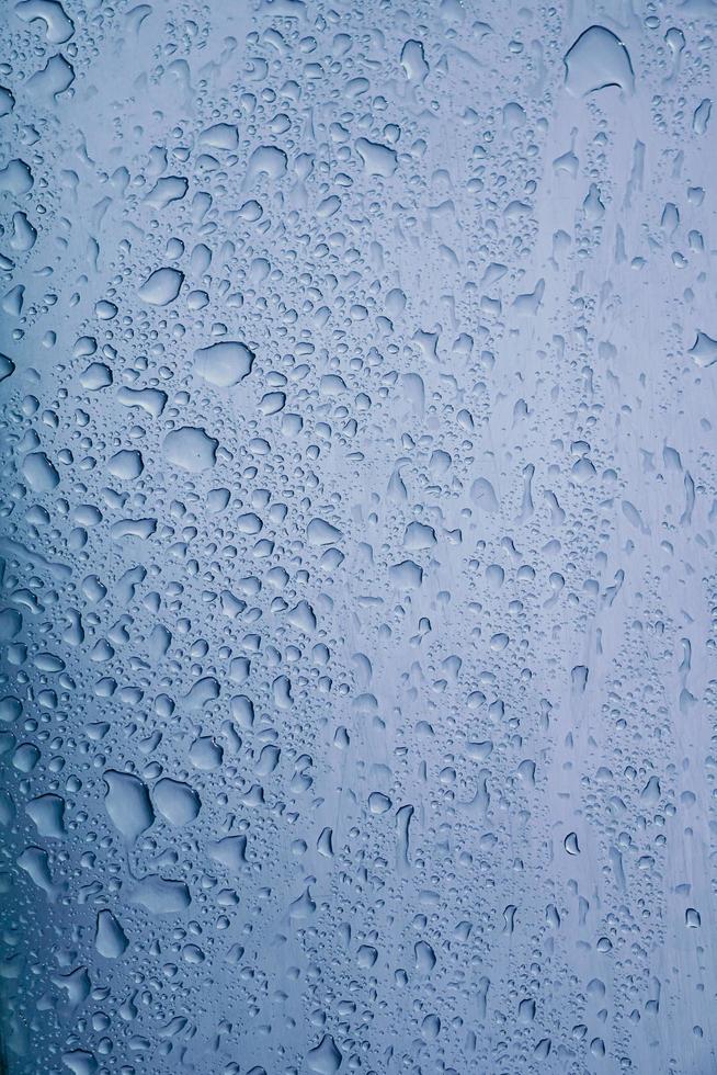 raindrops on the window in rainy days, abstract background photo
