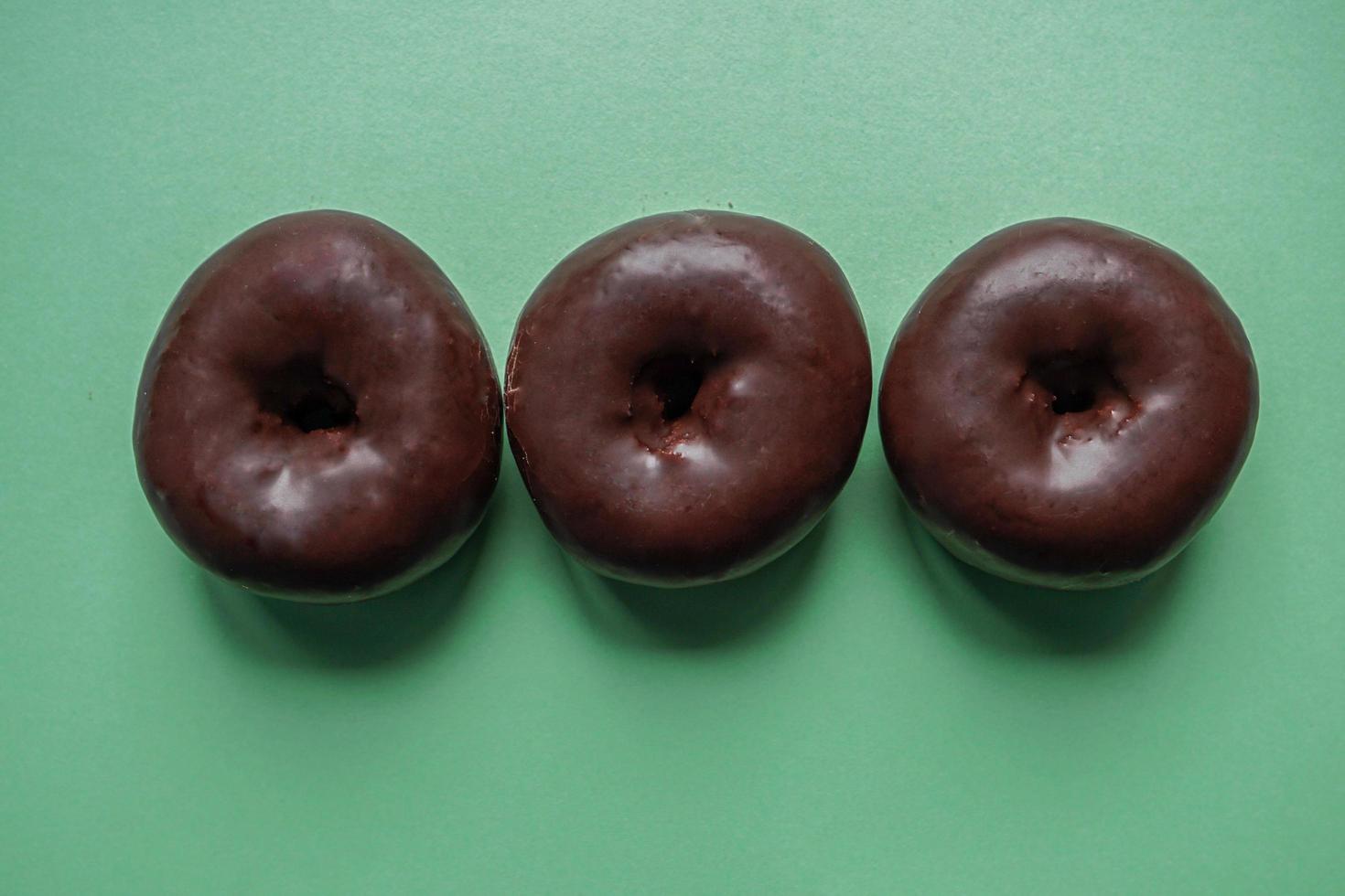 tasty chocolate donuts for breakfast, unhealthy food photo