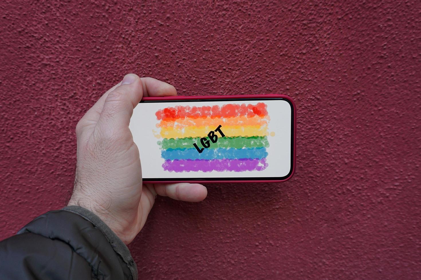 lgbt flag on the screen of the phone photo