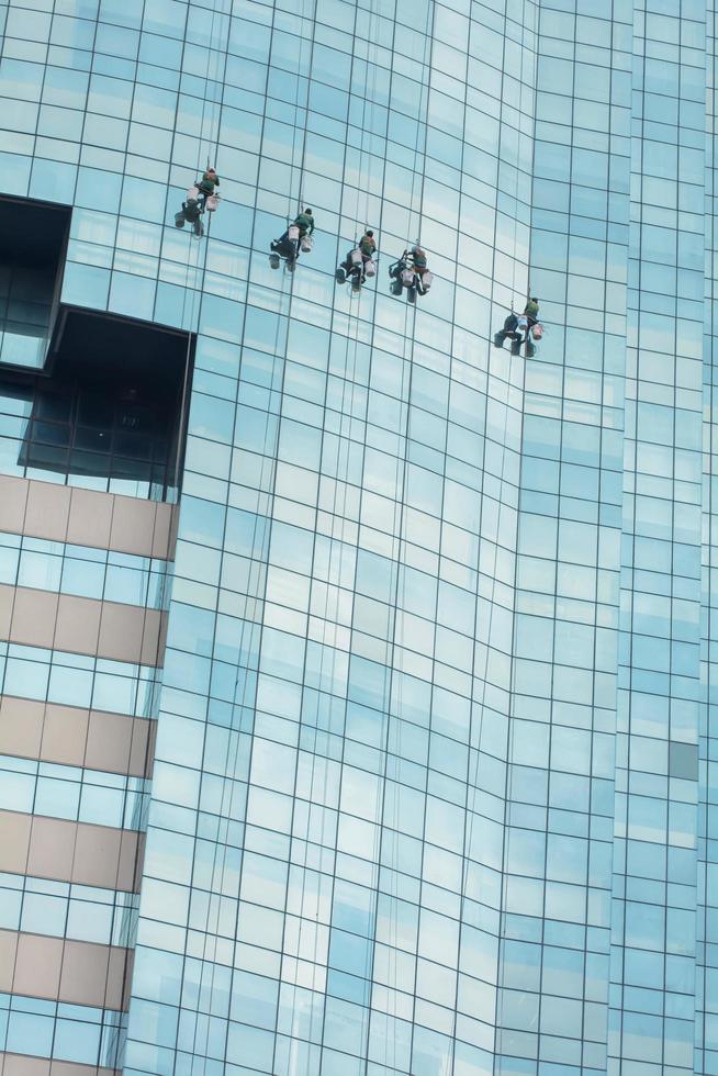 Men are cleaning the glass skyscrapers photo