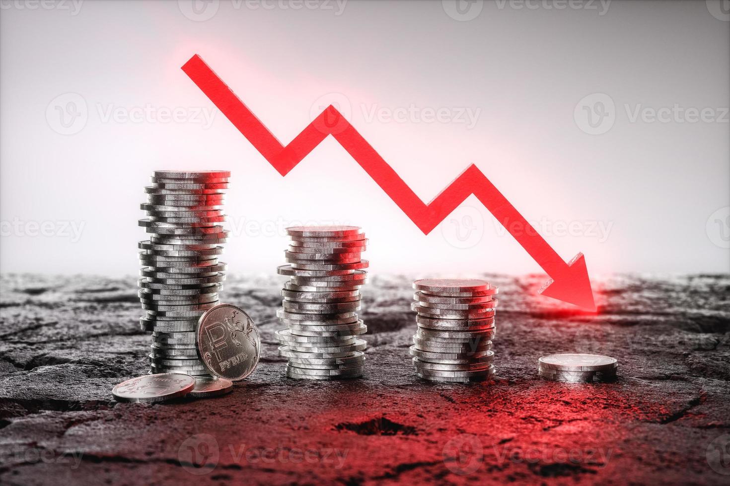 Russian Ruble coins stacked from higher to lower with a falling red arrow. 3d rendering photo