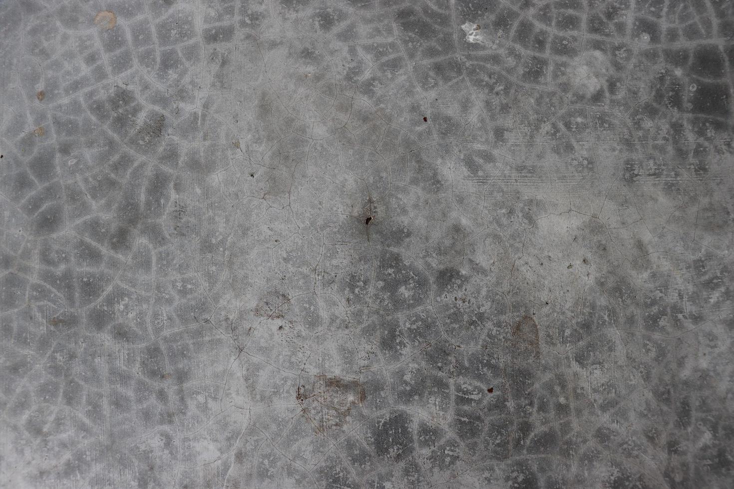 Broken concrete close-up photoshoot surface texture. Cement wall with gray color texture and grunge effect photo. Cracked concrete texture in the vintage gray color floor close-up shot. photo