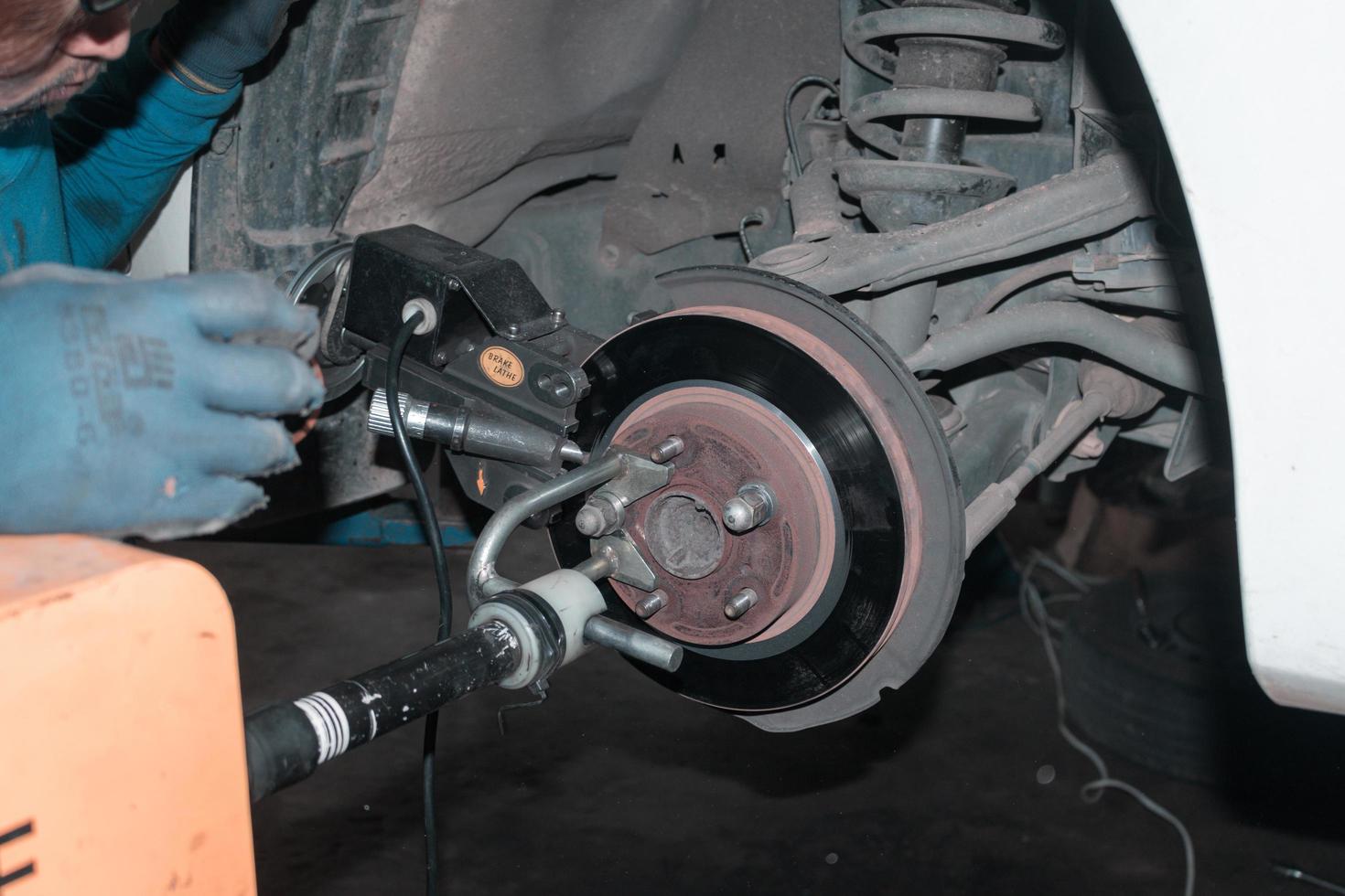 The mechanic is checking the engine. photo