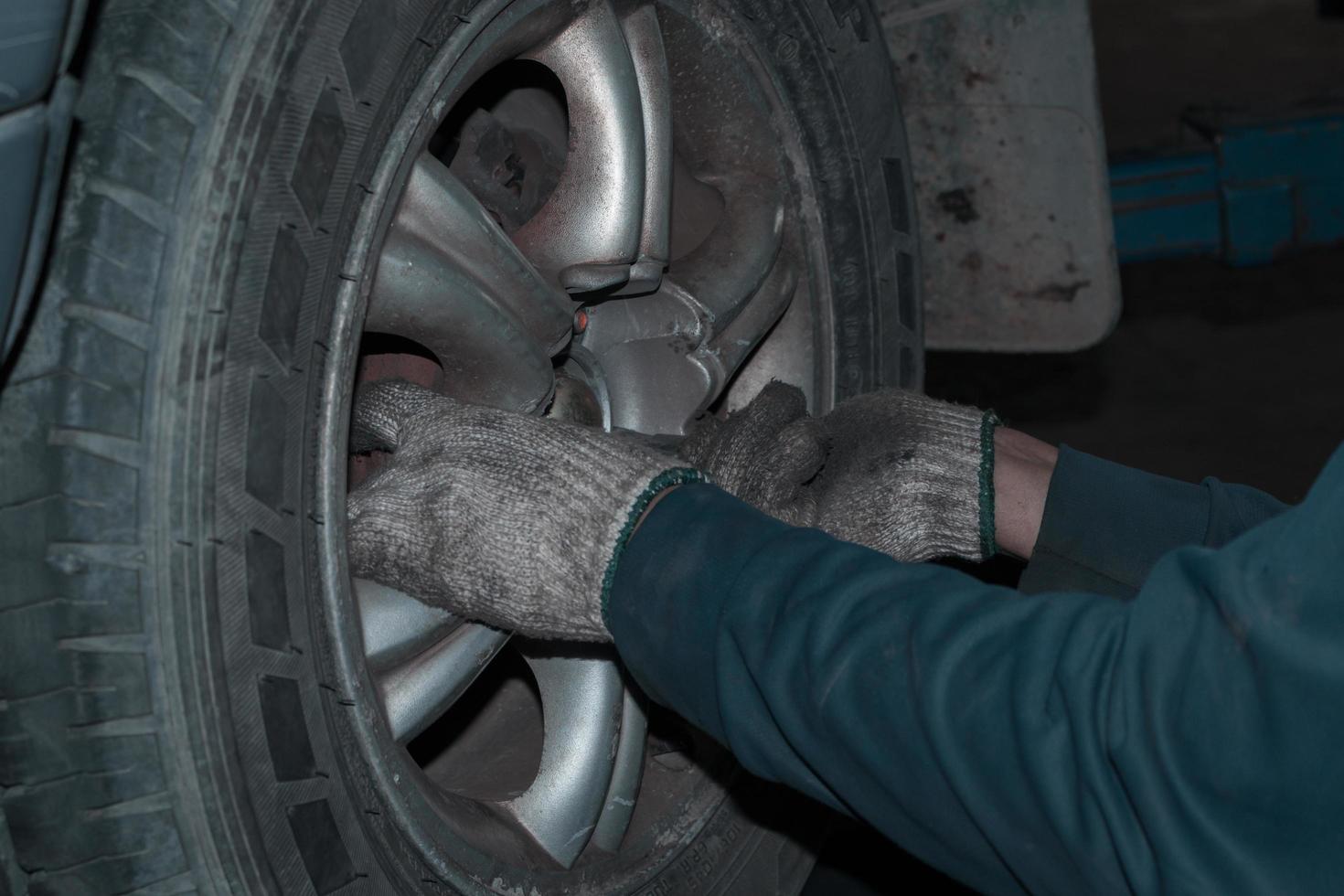 The mechanic is checking the engine. photo