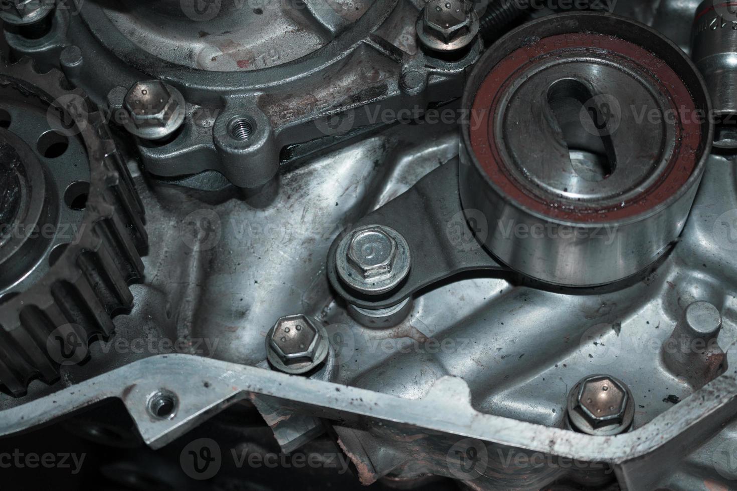 The mechanic is checking the engine. photo
