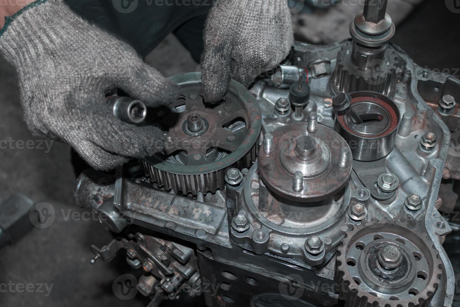 The mechanic is checking the engine. photo
