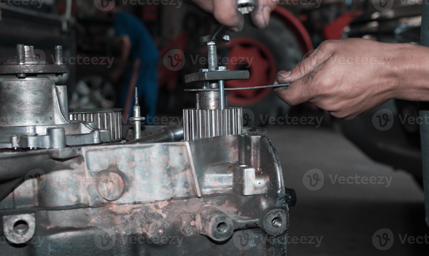 The mechanic is checking the engine. photo