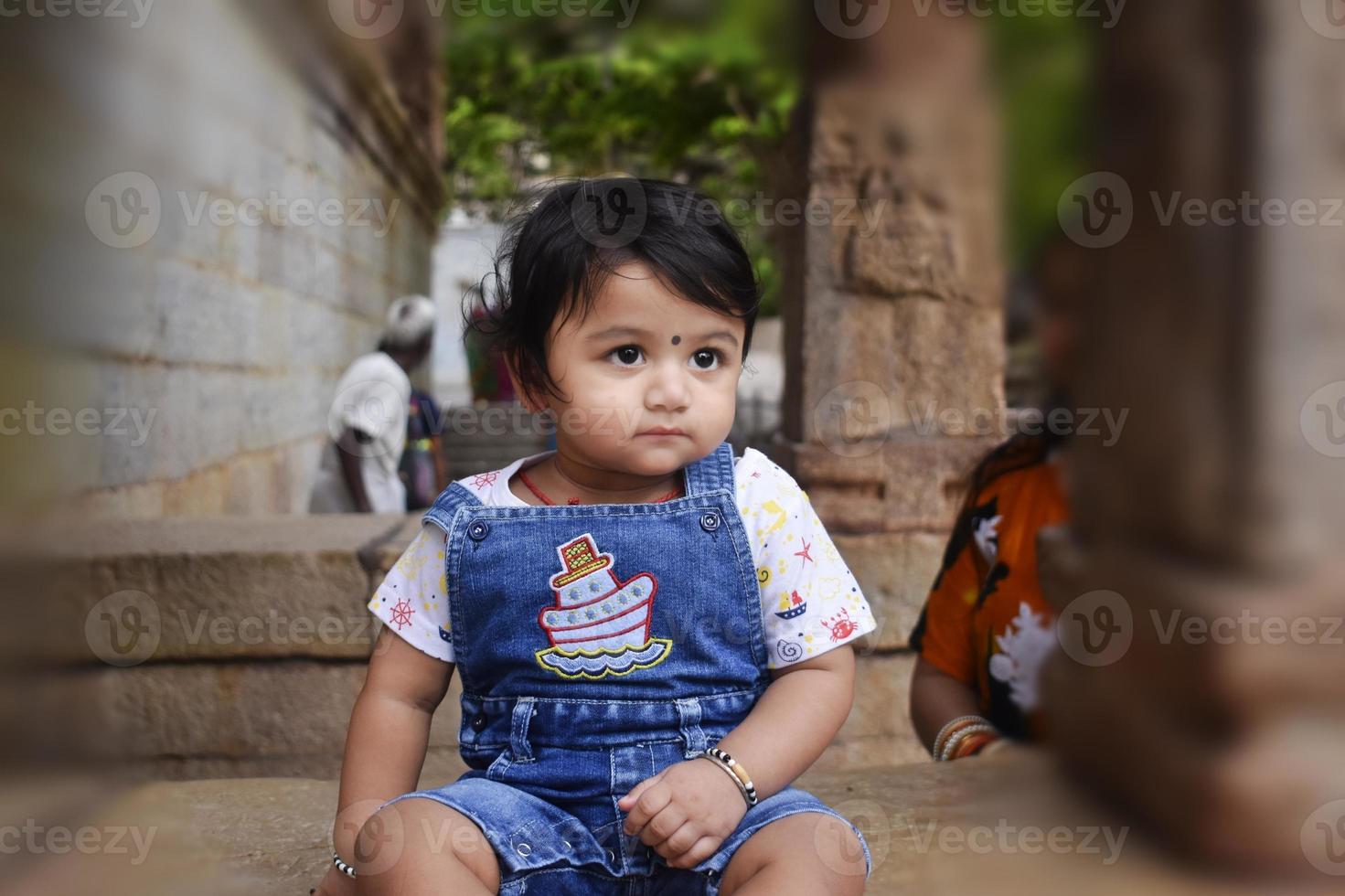 A cute little baby girl in joy mood photo