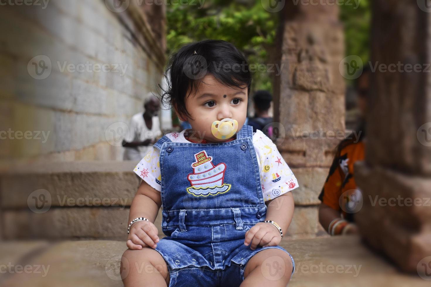 A cute little baby girl in joy mood photo