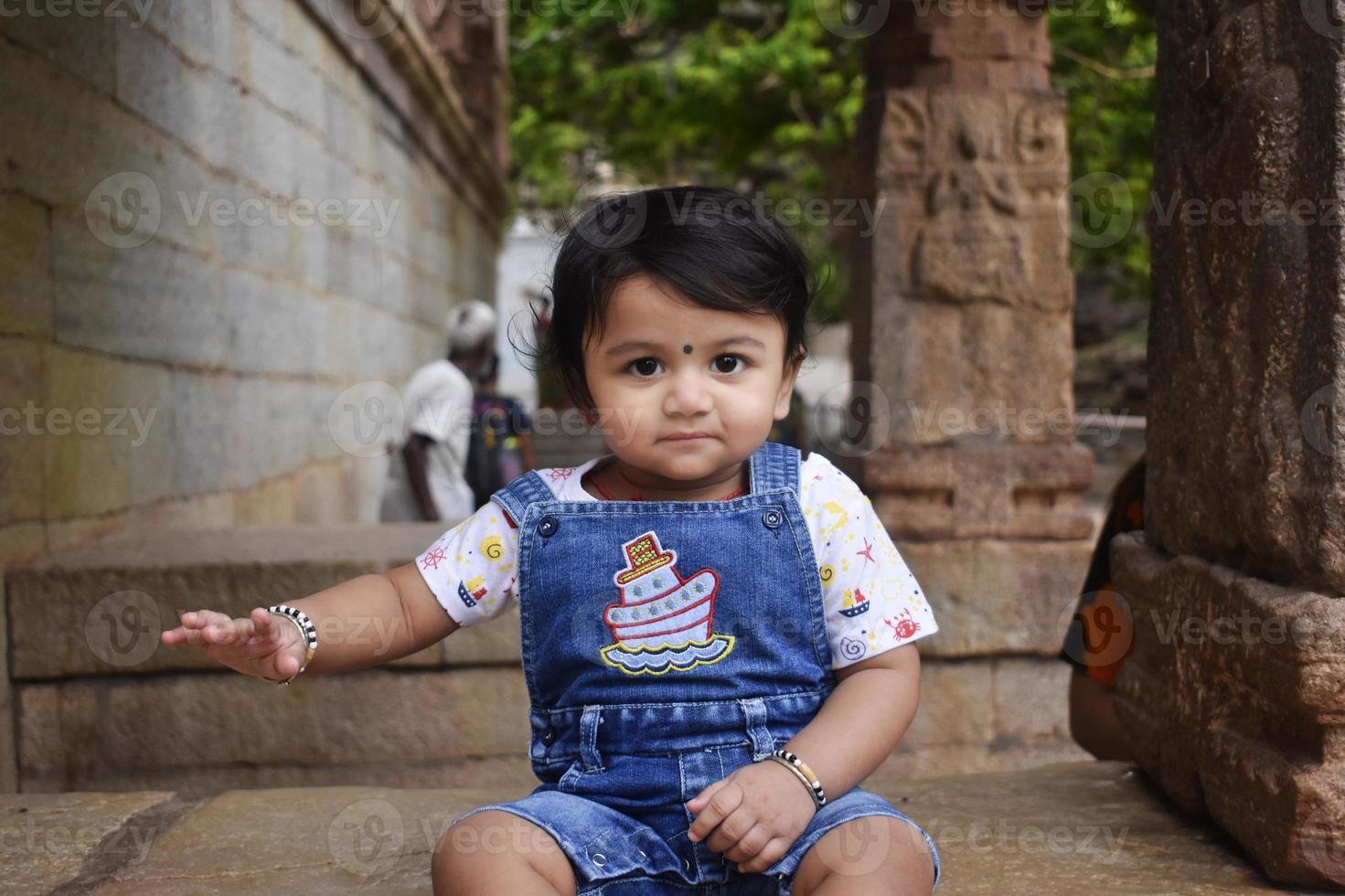 A cute little baby girl in joy mood photo