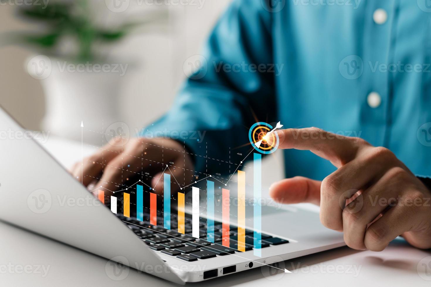 Businessman analyzing company's financial balance sheet working with digital augmented reality graphics. Businessman calculates financial data for long-term investment. photo