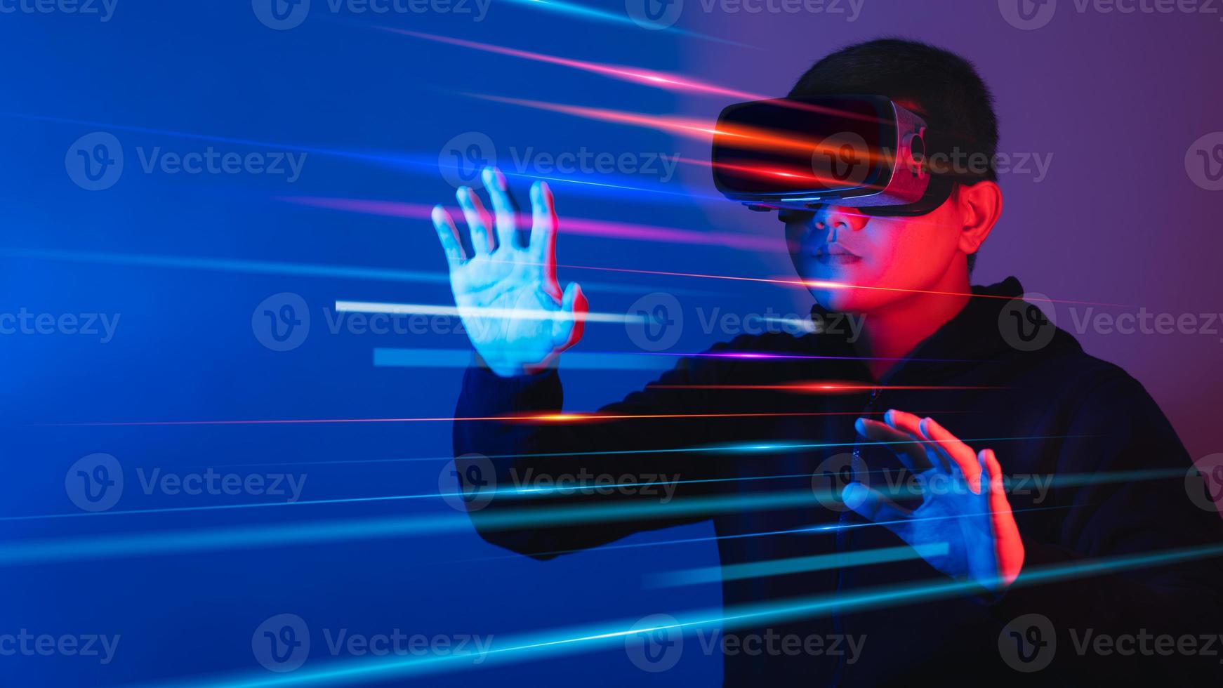 Young man wearing VR goggles. Metaverse technology virtual reality concept. Virtual Reality Device, Simulation, 3D, AR, VR, Innovation and Technology of the Future on Social Media. photo