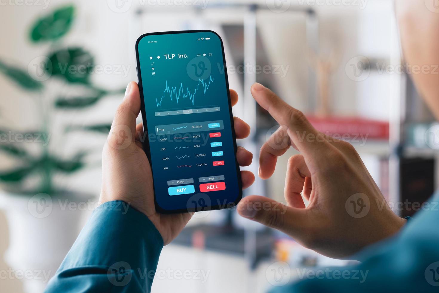 Businessmen work with stock market investments using smartphone to analyze trading data. smartphone with stock exchange graph on screen. Financial stock market. photo