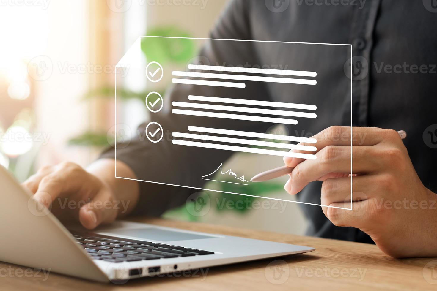 Electronic Signature Concept, Electronic Signing Businessman signs electronic documents on digital documents on virtual laptop screen using stylus pen. photo