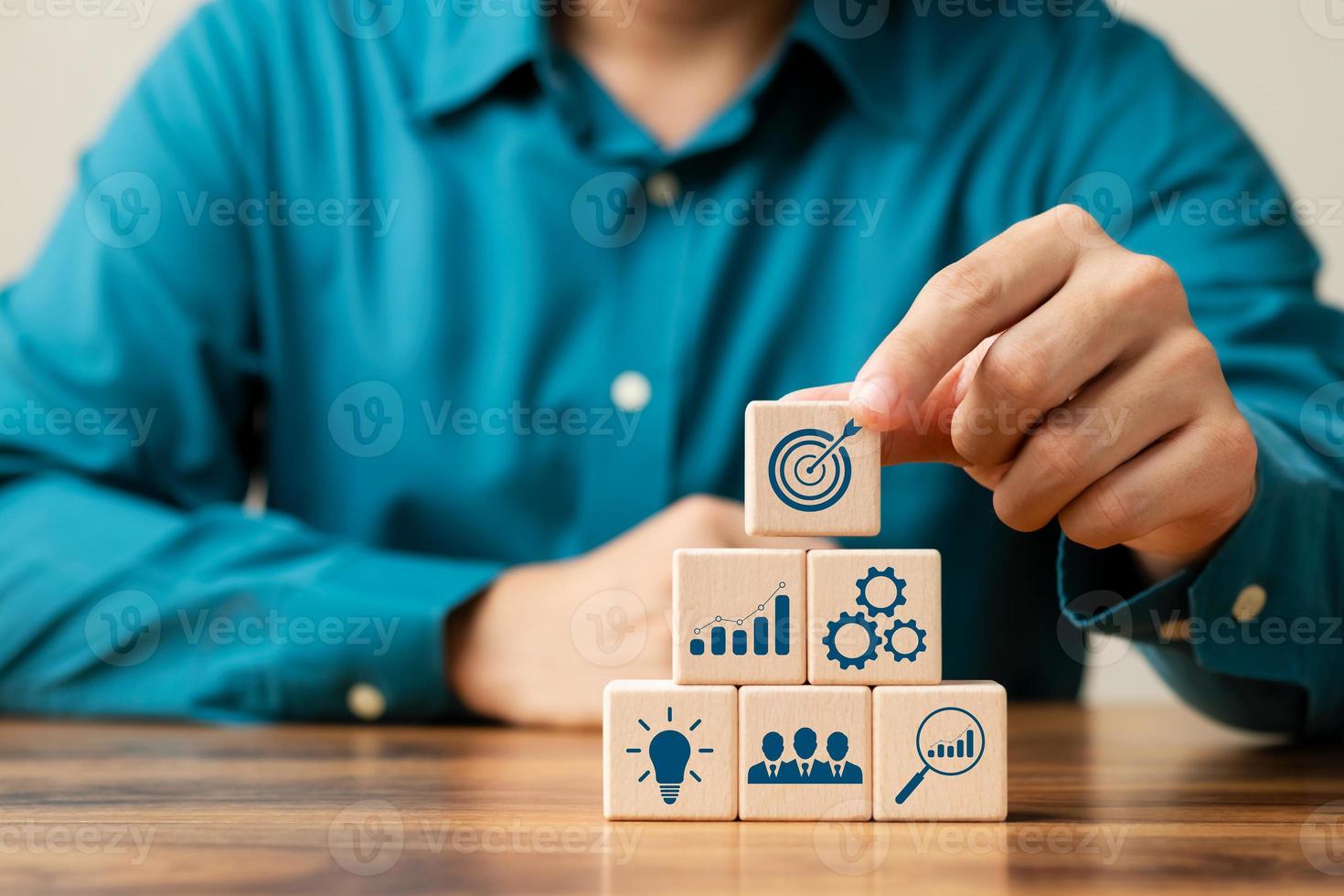 hand woods block cube with icon company strategy development, Concept success and business goals. photo