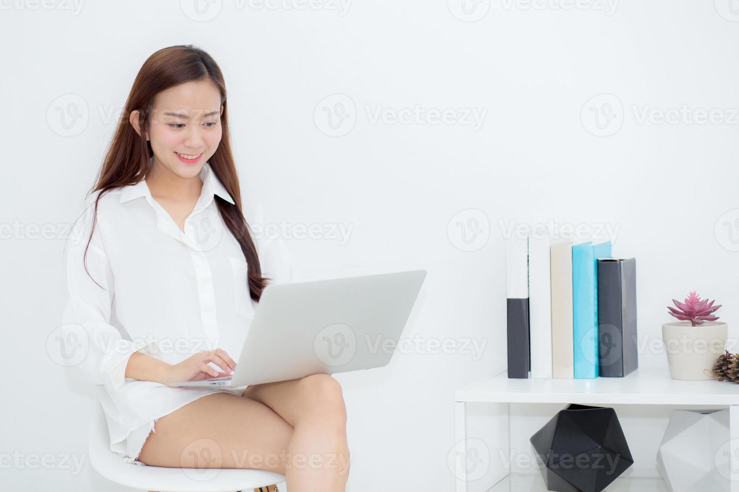 Beautiful young asian woman using laptop for leisure on sofa, girl working online with notebook freelance, communication business concept. photo