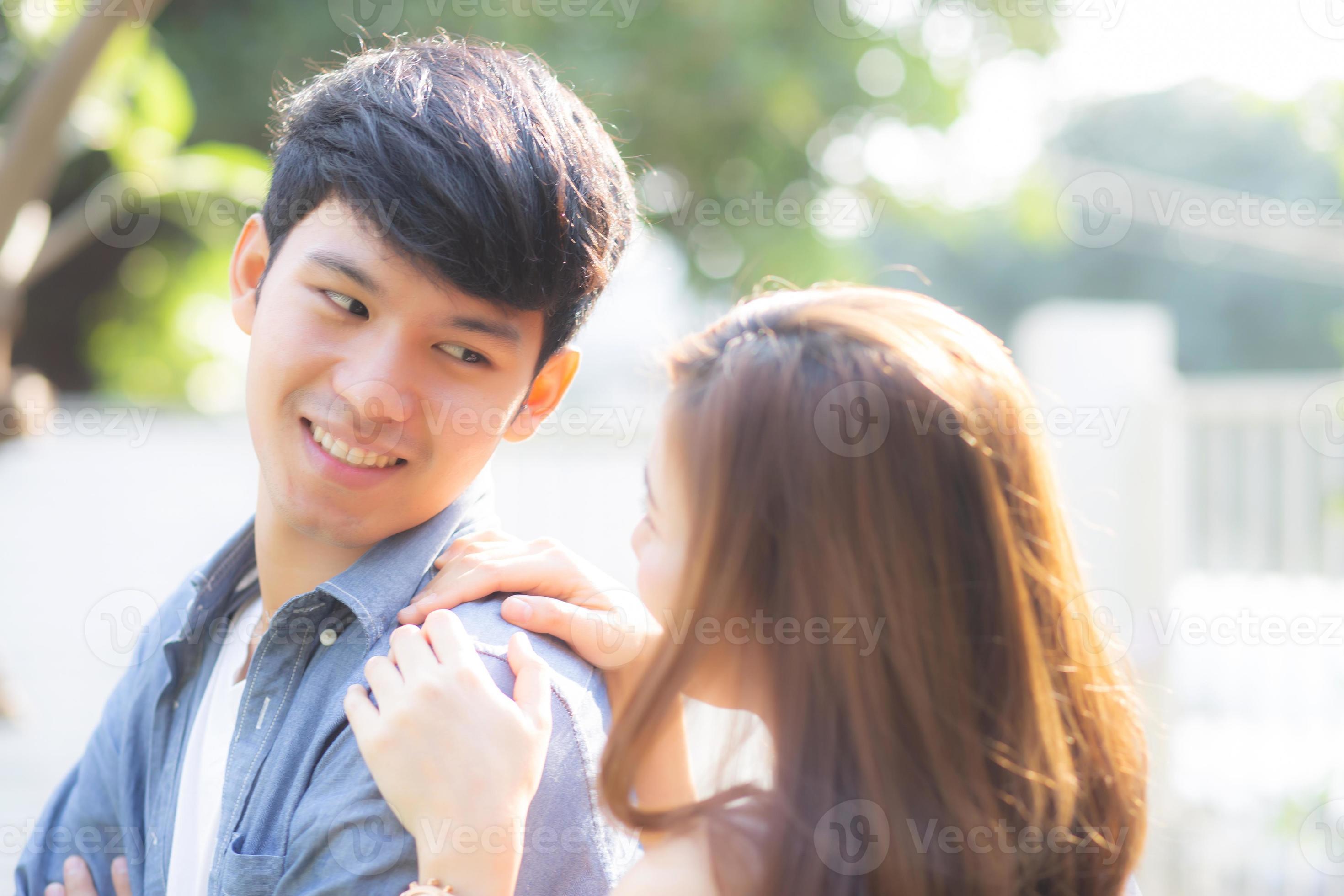 beautiful portrait couple looking each others eyes and smiling with happy young asian man and woman relation with love dating husband and wife feeling and emotion lovers and lifestyle concept photo
