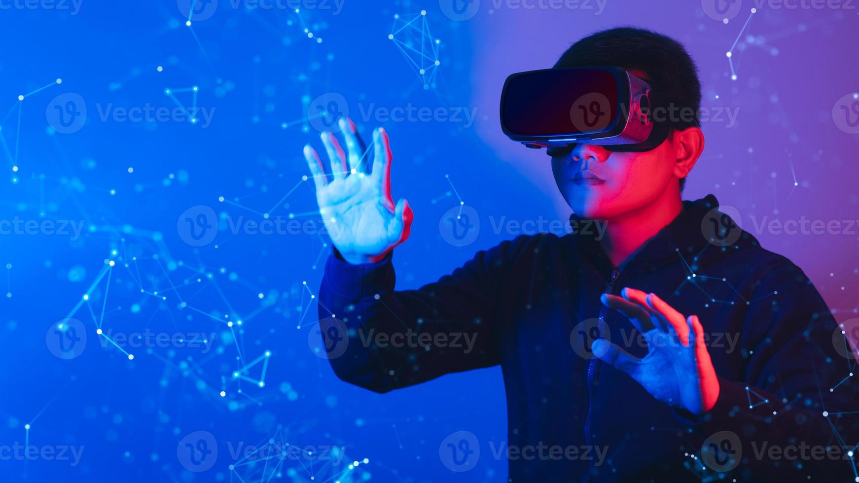 Young man wearing VR goggles. Metaverse technology virtual reality concept. Virtual Reality Device, Simulation, 3D, AR, VR, Innovation and Technology of the Future on Social Media. photo