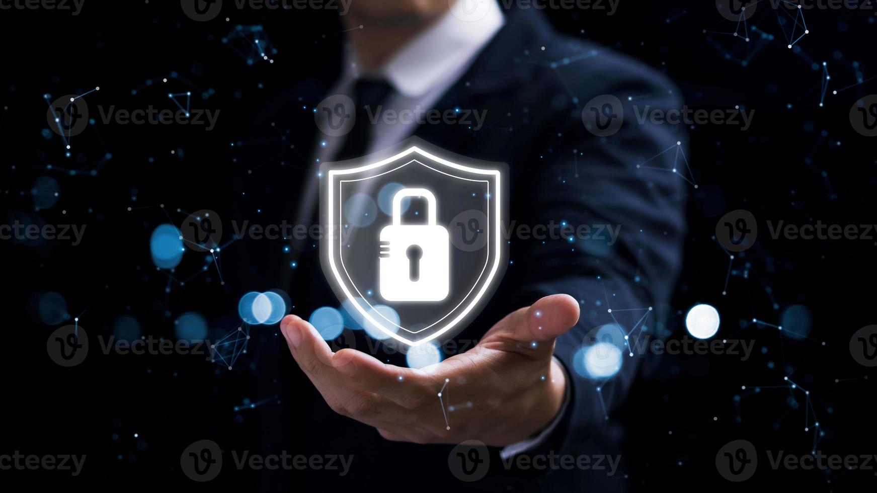 Cybersecurity data protection. Businessman holding padlock protect business financial and virtual cyber network connections. development of intelligent technology innovations from digital attacks. photo