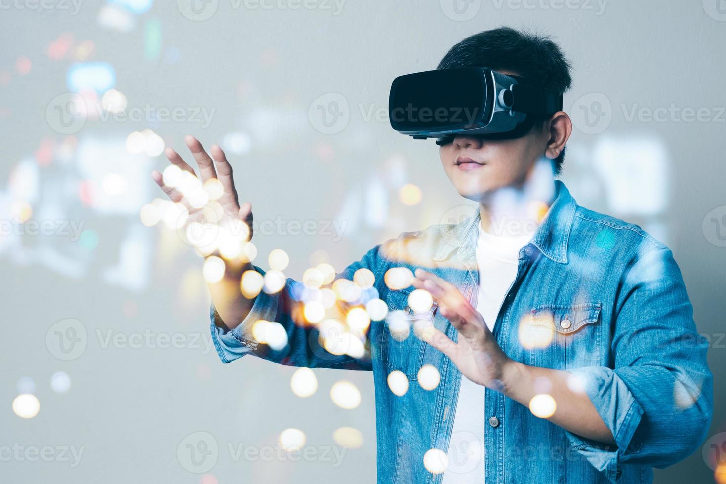 Young man wearing VR goggles. Metaverse technology virtual reality concept. Virtual Reality Device, Simulation, 3D, AR, VR, Innovation and Technology of the Future on Social Media. photo