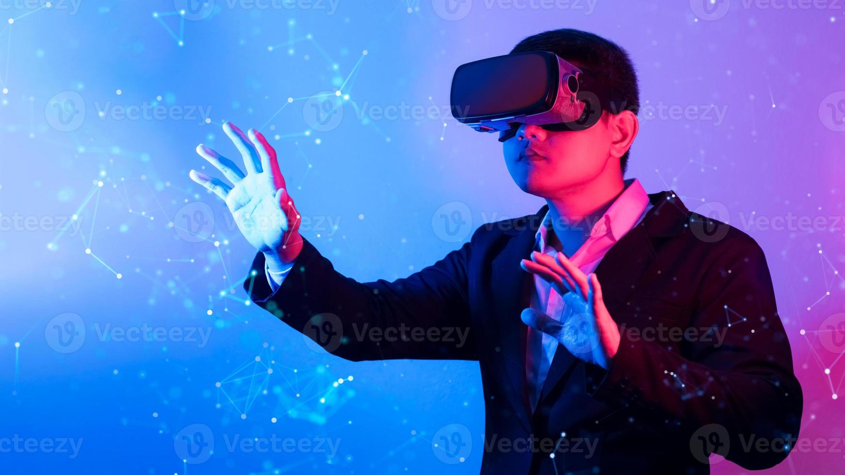 Young man wearing VR goggles. Metaverse technology virtual reality concept. Virtual Reality Device, Simulation, 3D, AR, VR, Innovation and Technology of the Future on Social Media. photo