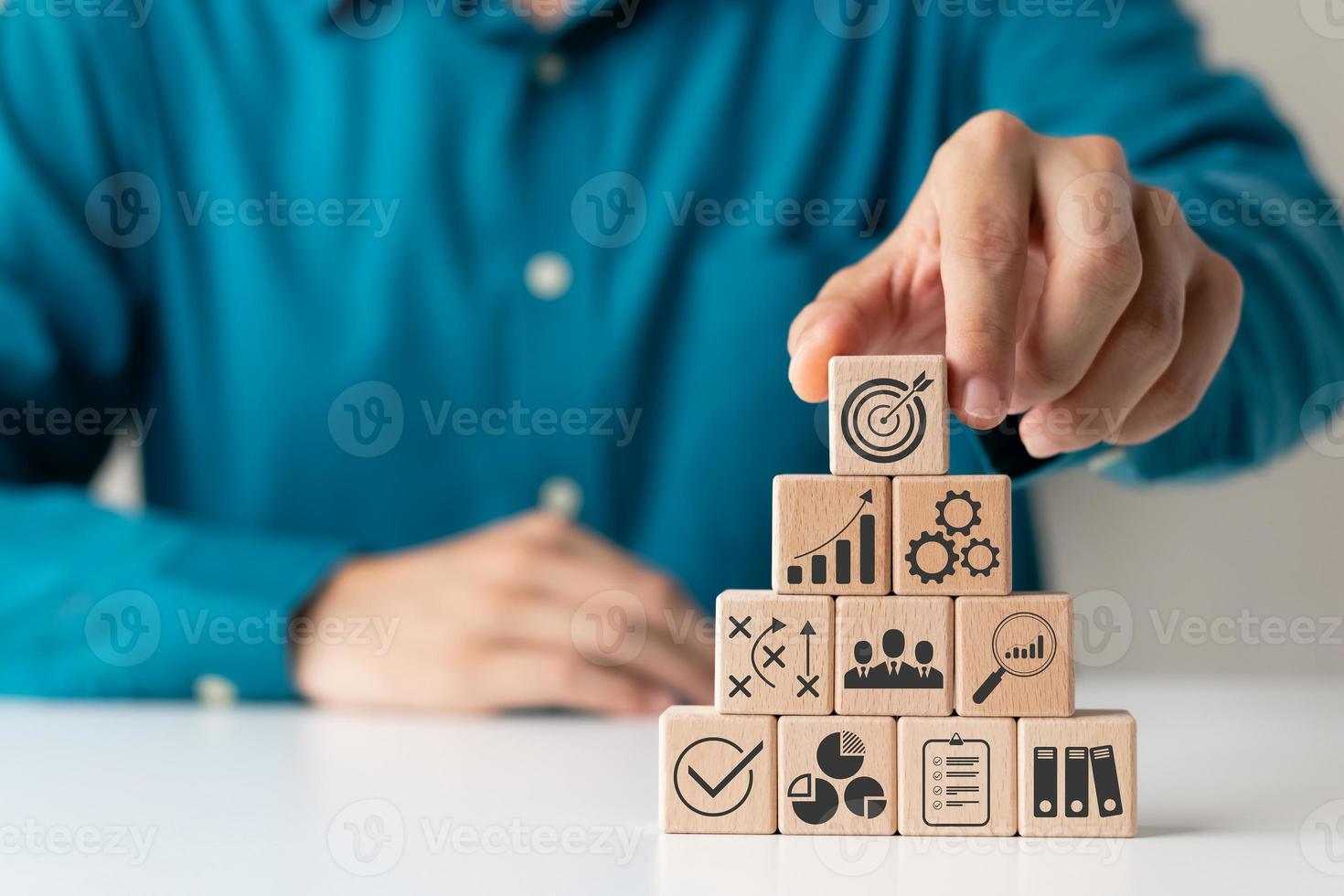 hand woods block cube with icon company strategy development, Concept success and business goals. photo