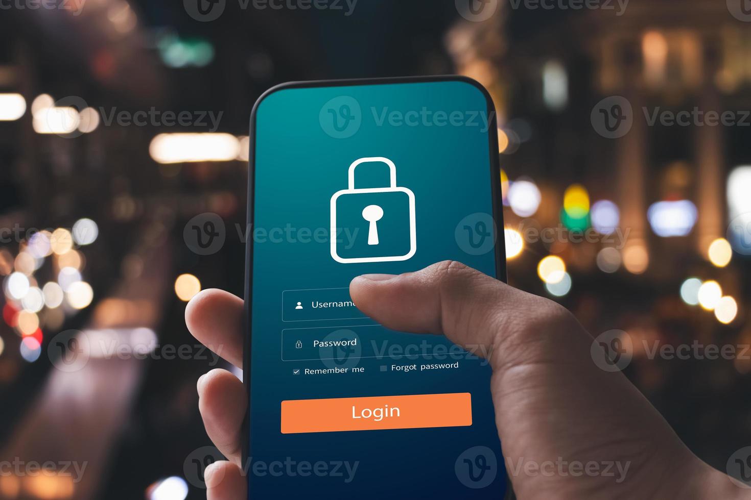 Cybersecurity internet and networking concept. Close up of hand holding smartphone information security and encryption, secure access to user's personal information, secure Internet access. photo